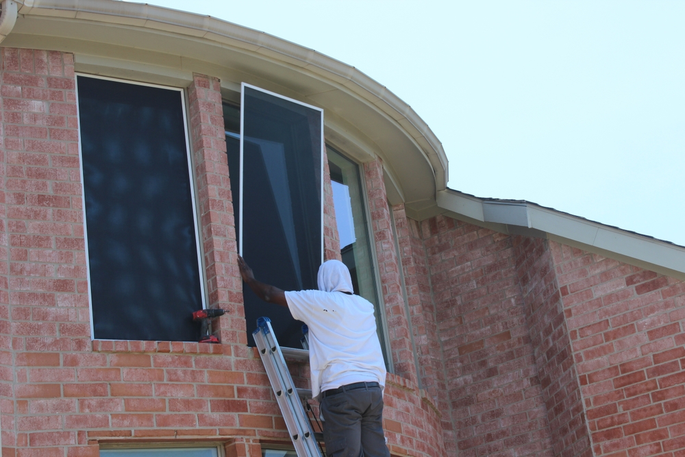 Solar,screens,installed,on,windows,at,a,residential,house,in